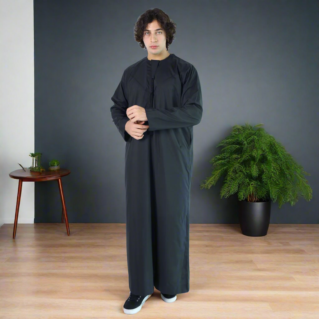 Man wearing a black long-sleeve garment on a white background