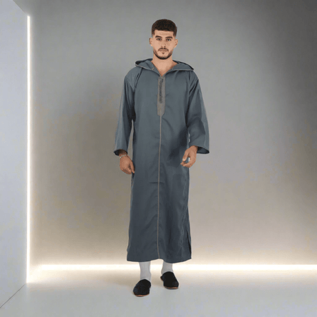 Man wearing a long gray robe on a white background