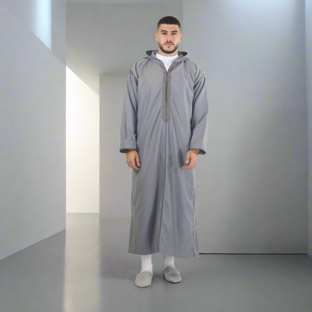 Man wearing a long gray robe on a white background