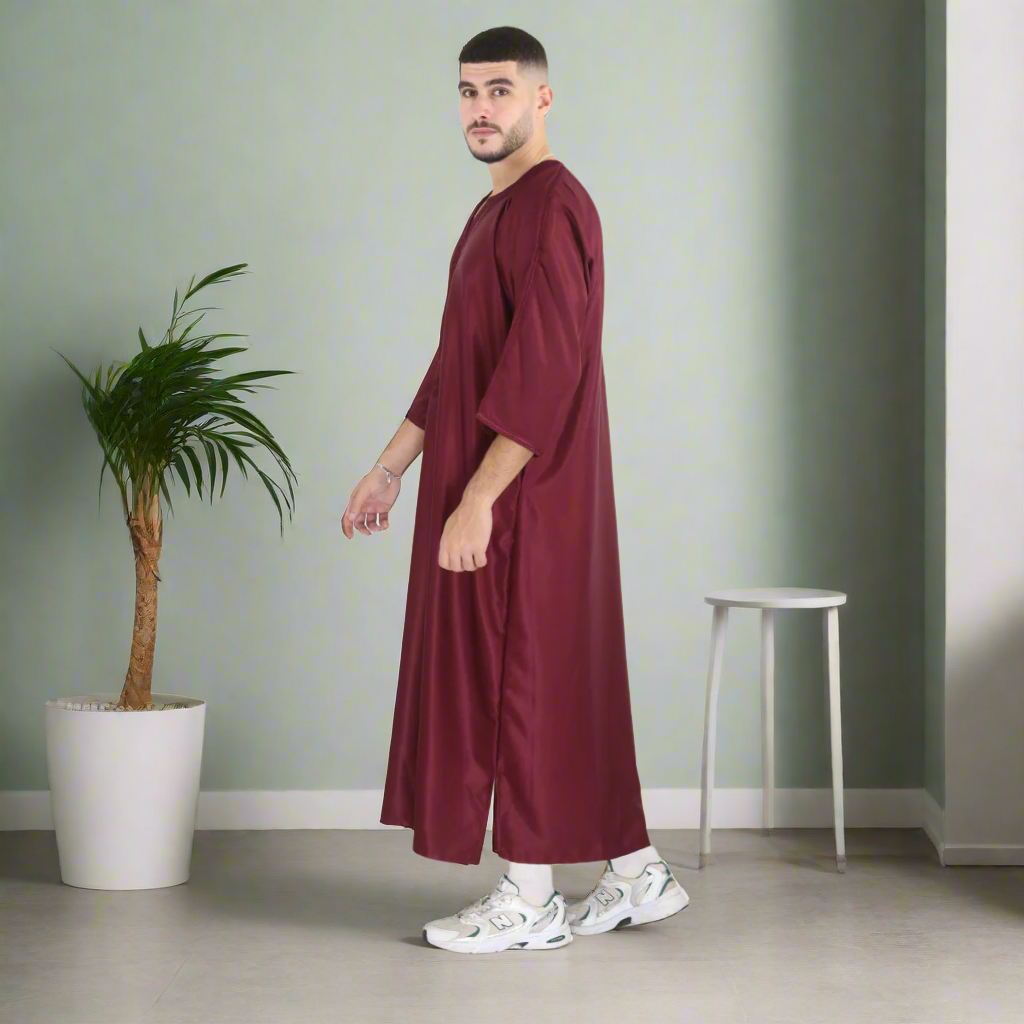 Man wearing a burgundy robe on a white background