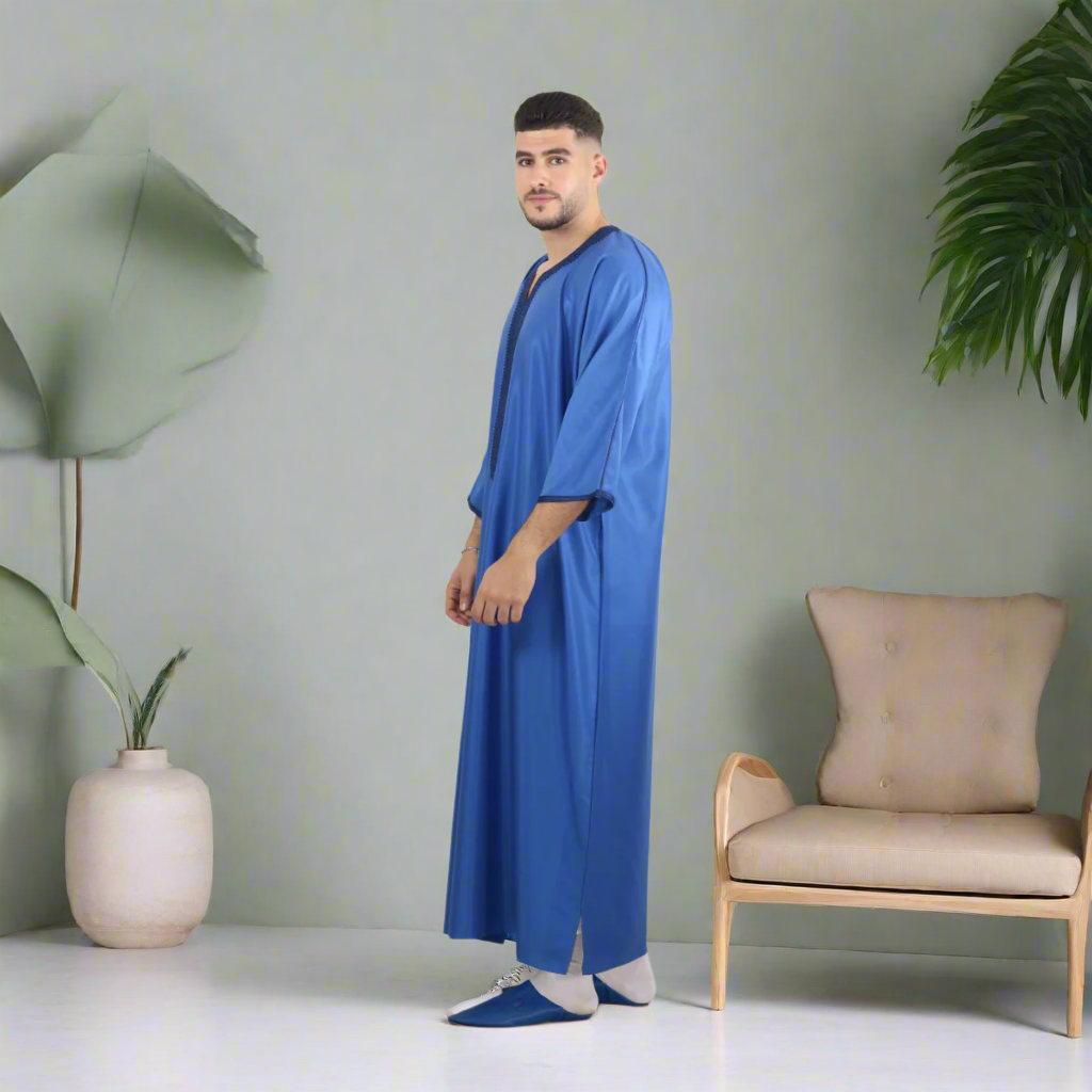 Man wearing a blue robe against a white background