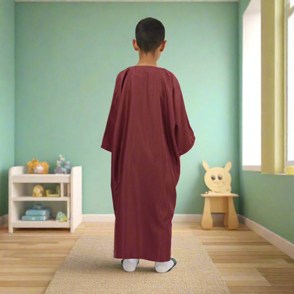 Person wearing a burgundy robe on a white background