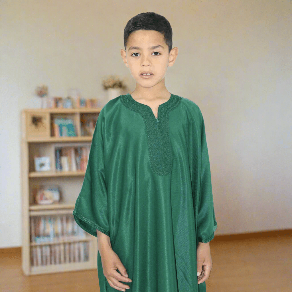 Child wearing a green traditional outfit on a white background